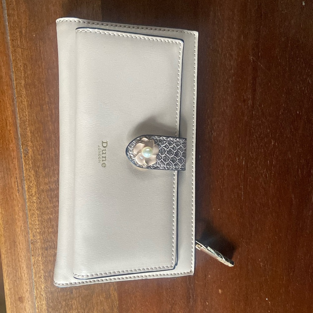 Never used before wallet in baby pink from Dune